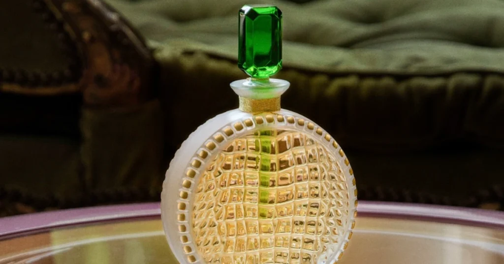 Lalique perfume bottle with green lid