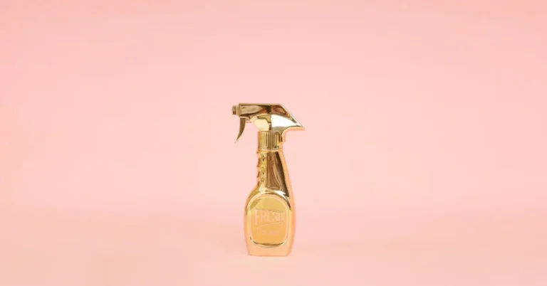 Fancy looking gold perfume spray bottle from Moschino
