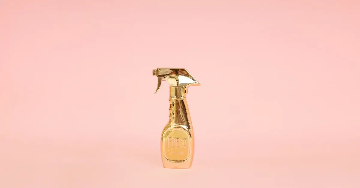 Fancy looking gold perfume spray bottle from Moschino