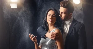 Woman and Man spraying a top rated pheromone perfume around them