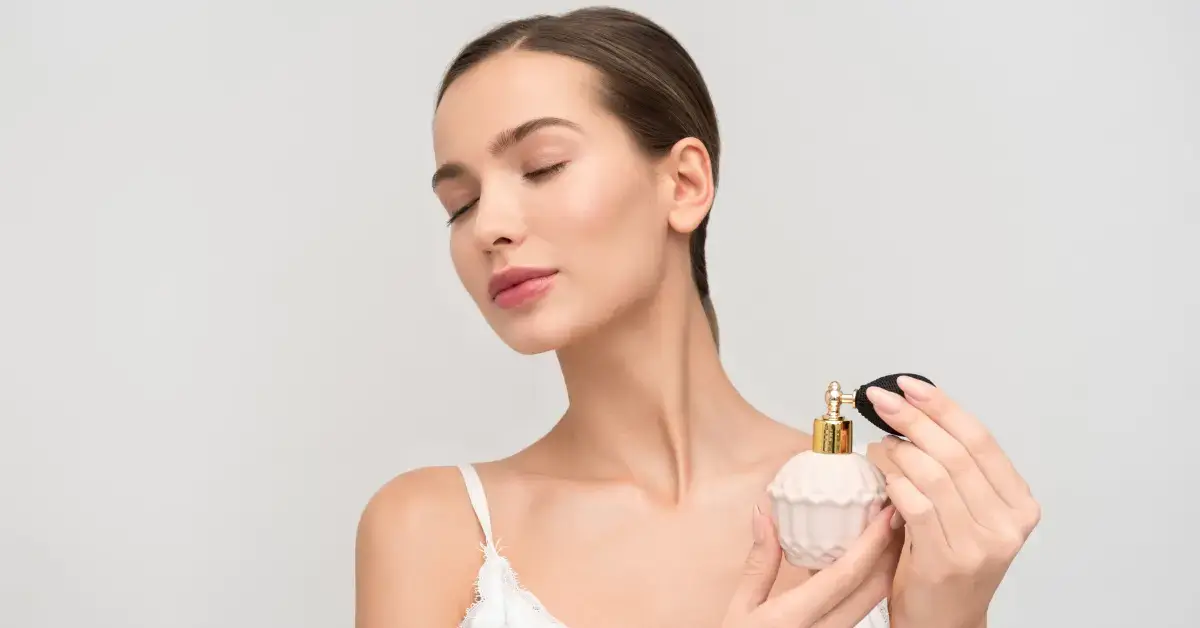 women with fresh fragrances for her in her hand
