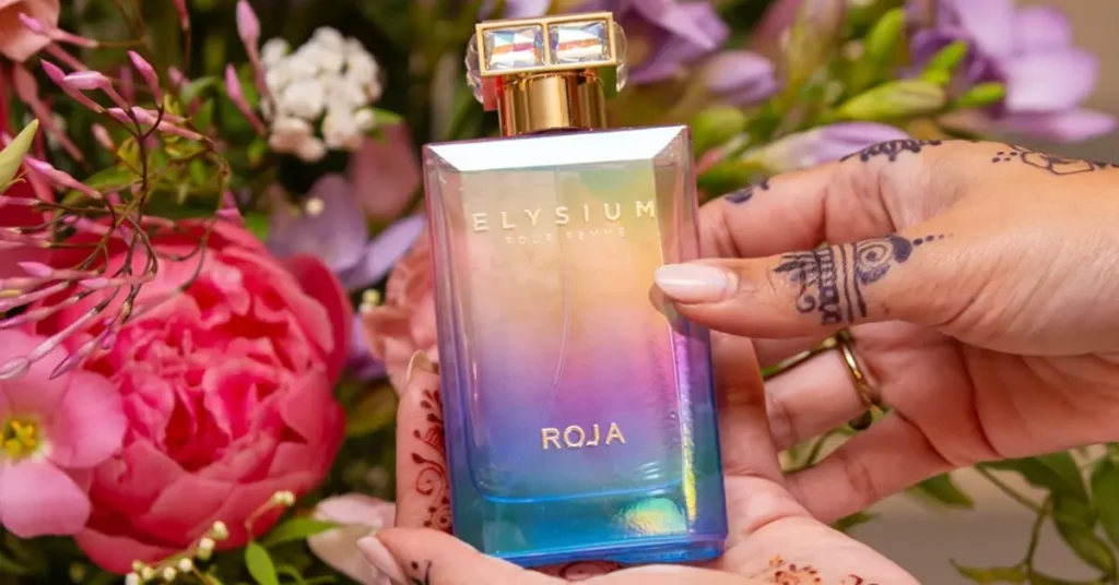 Elysium pour Femme, Roja Parfums in field with flowers, a new summer perfume 2024